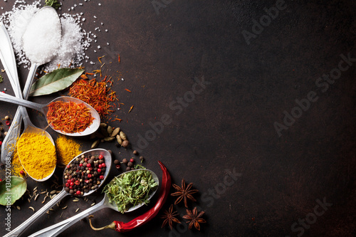 Fototapeta Naklejka Na Ścianę i Meble -  Various spices spoons on stone table