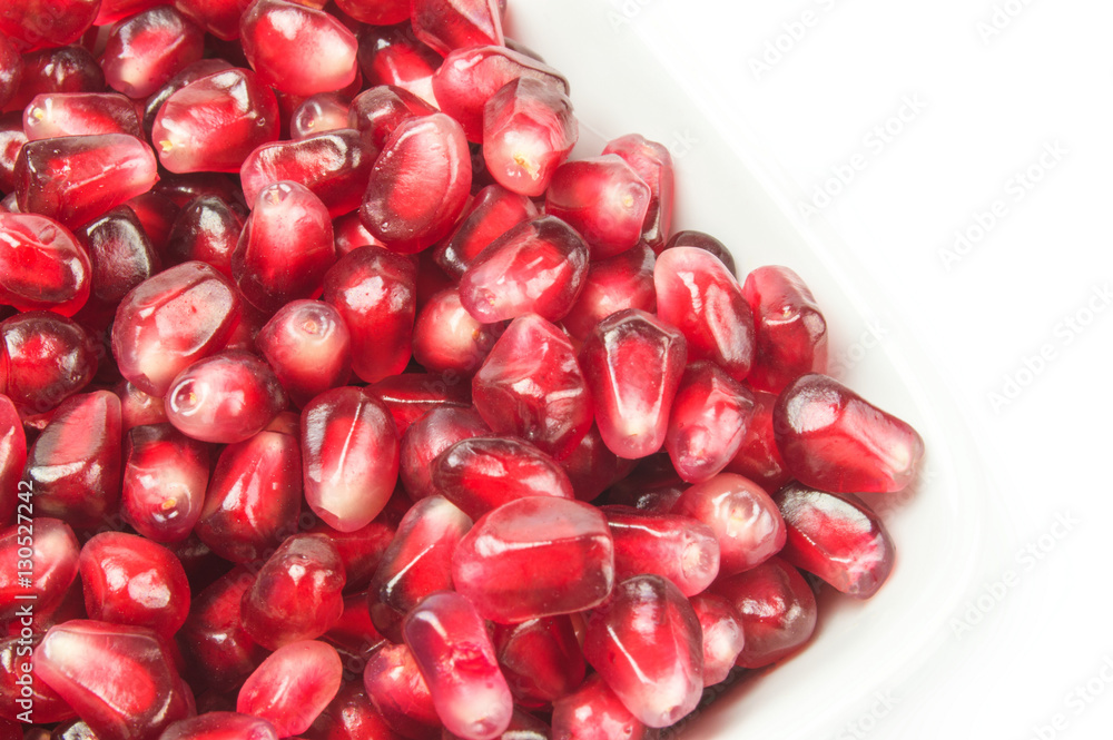 Juicy pomegranate fruit isolated on a white background cutout Juicy pomegranate fruit isolated on a white background cutout