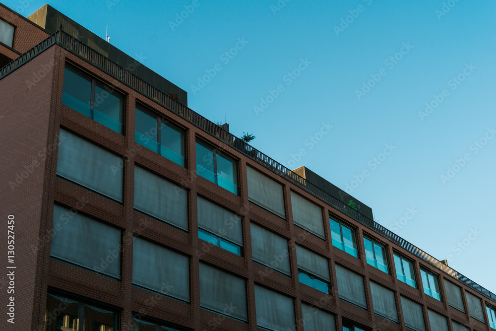 big office building with closed and open windows