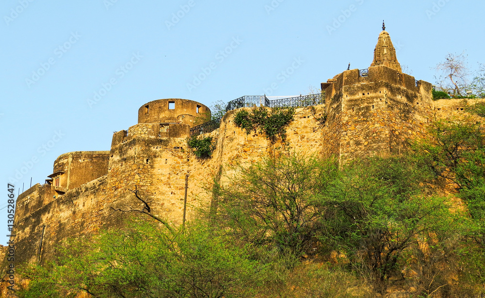 View of the wall and towers Moti Dungri Fort, an ancient fortress of the 16th century in Jaipur, India