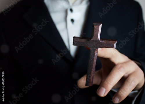 man holding cross