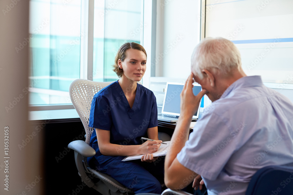 Doctor In Consultation With Depressed Male Patient Doctor In Consultation With Depressed Male Patient