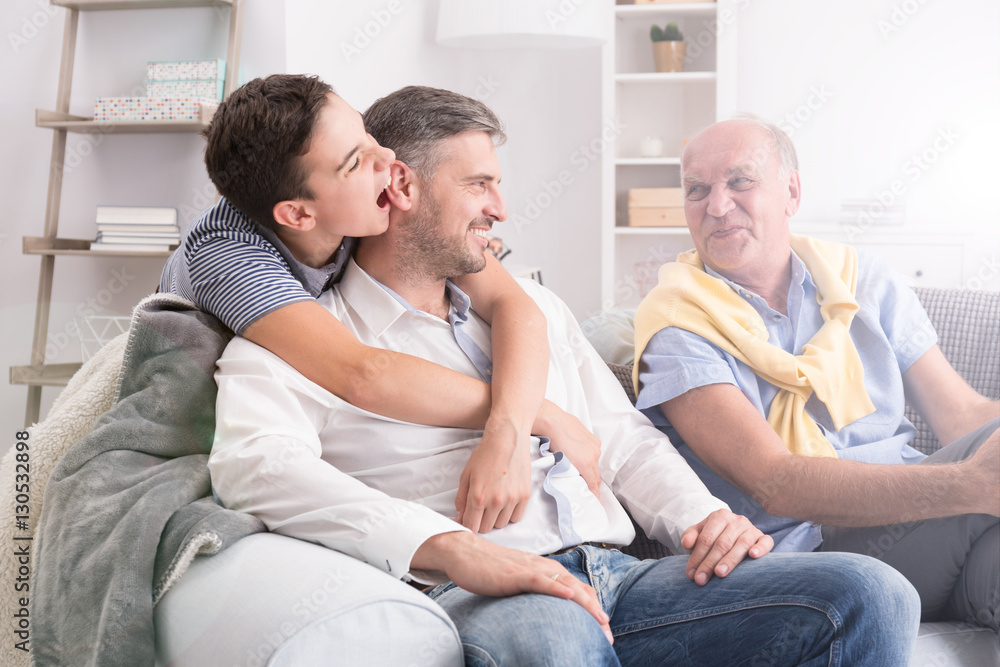 Son embracing his father Son embracing his father