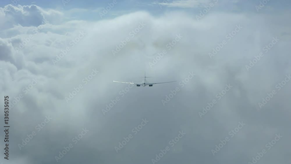 The plane is flying through the clouds The plane is flying through the clouds