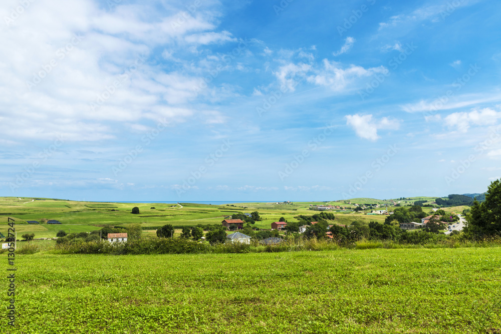 Landscape of meadows with several farms in Cantabria, Spain Landscape of meadows with several farms in Cantabria, Spain