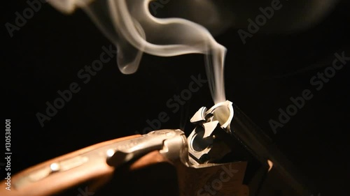 Smoke from the trunks of smooth-bore hunting rifle after firing.