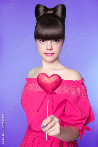 Attractive teen girl with bow hair style, brunette young model h