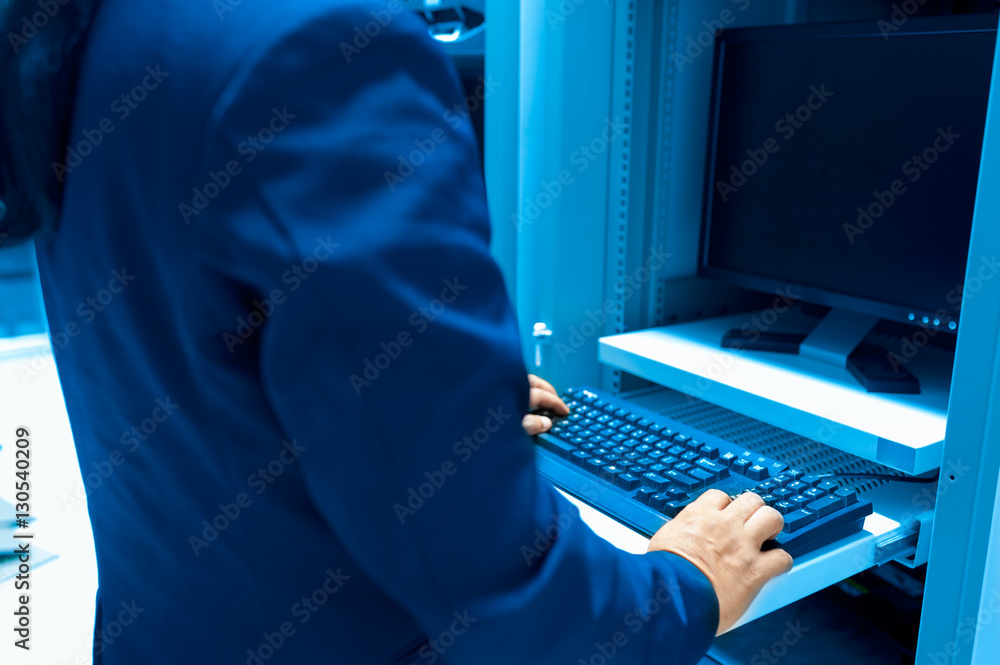 Man fix server network in data center room Man fix server network in data center room