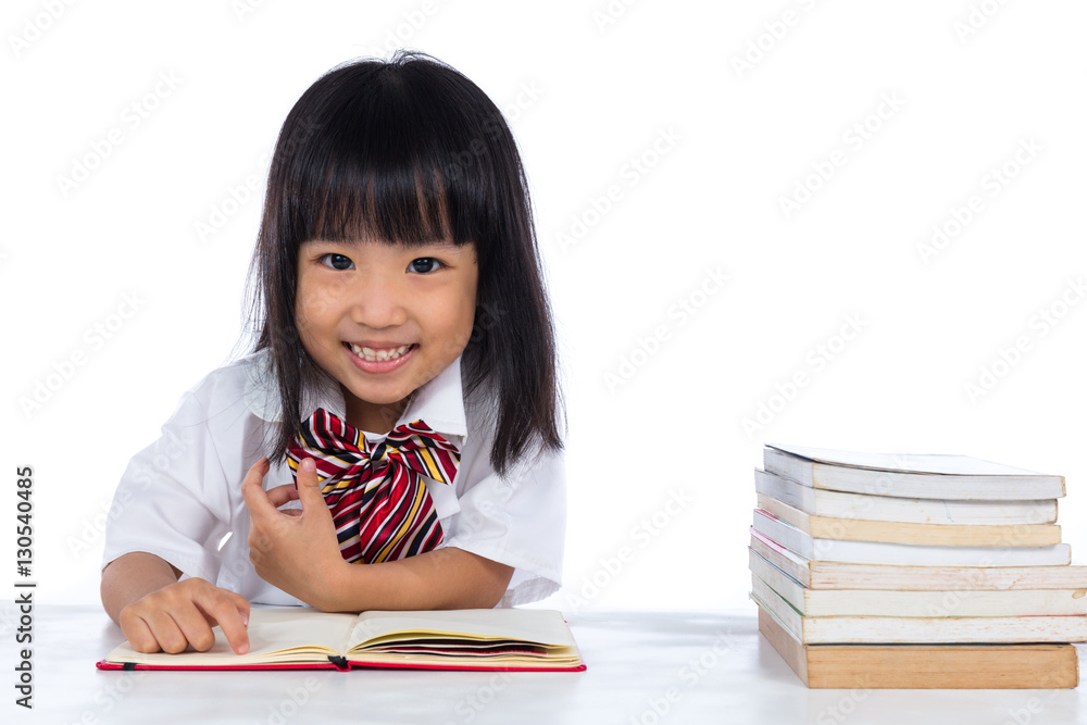 Happy Asian Chinese little girl reading book Happy Asian Chinese little girl reading book