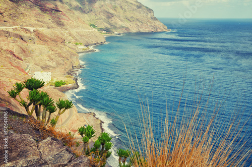 Playa de Las Gaviotas aerial view. Tenerife minimalist seascape with rocks. Filtered image, cross processed vintage effect. Tenerife, Canary islands, Spain.