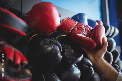 Kick boxer choosing gloves