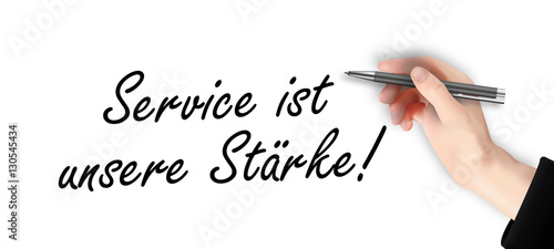 Service ist unsere Stärke - Hand schreibt Text