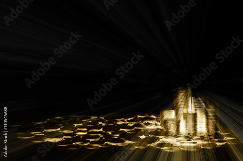 Light ray Gold coin concept on black background. Mortgage loadin photo