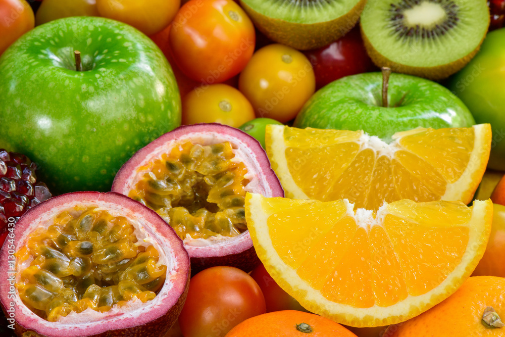 Closeup orange and passion fuits slice with group of ripe fruits Closeup orange and passion fuits slice with group of ripe fruits
