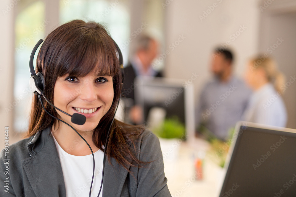 Smiling pretty business woman with headset Smiling pretty business woman with headset