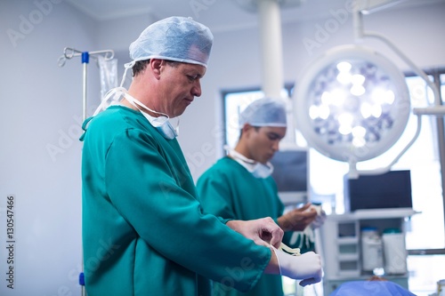 Surgeon wearing surgical gloves in operation theater