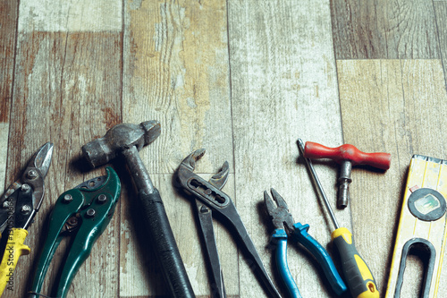 Working tools on wooden rustic background. top view