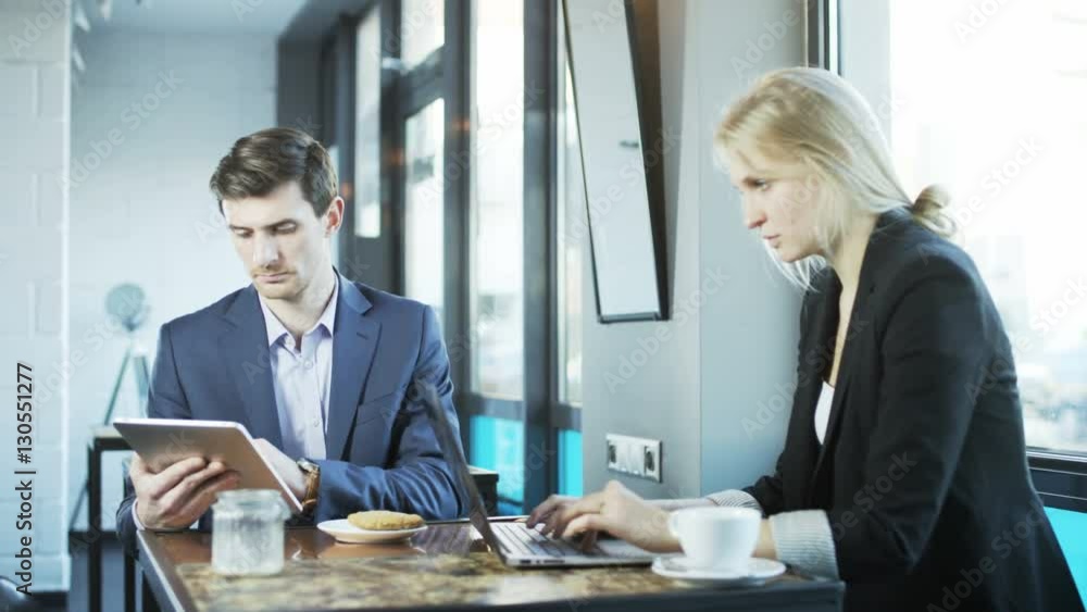 Business People Work and Look at Each Other Business People Work and Look at Each Other