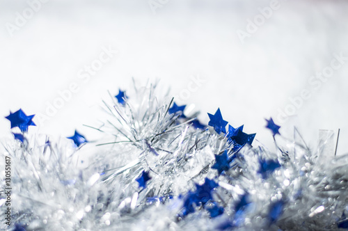 Christmas decoration - Silver and blue Christmas tinsel on white background