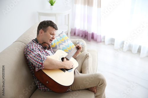Young man with headphones p...