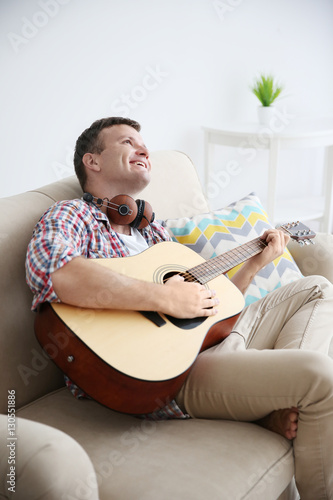 Young man with headphones p...