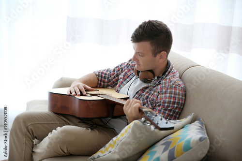 Young man with headphones p...