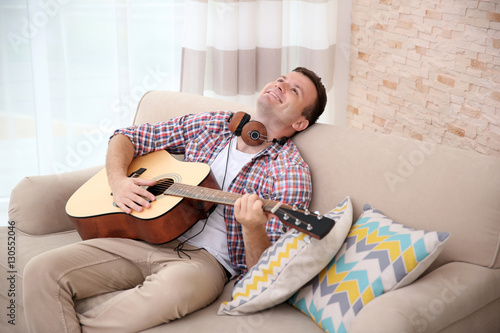 Young man with headphones p...