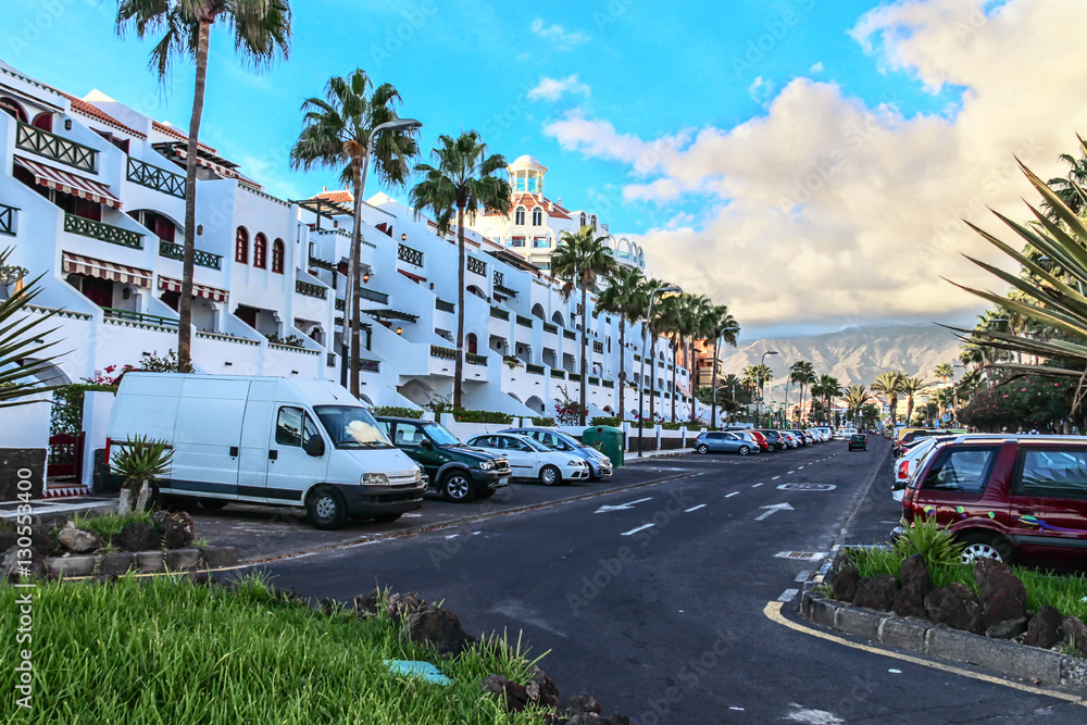 typical for Tenerife city skyline - white houses, straight streets, mountains on the horizon and blue sky