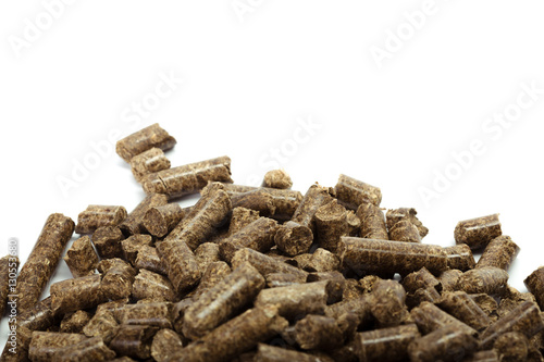 stack of wooden pellets for bio energy  white background  isolated