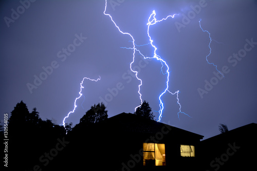 Urban Rooftop Electric Lightning Strike in Evening Thunder Storm