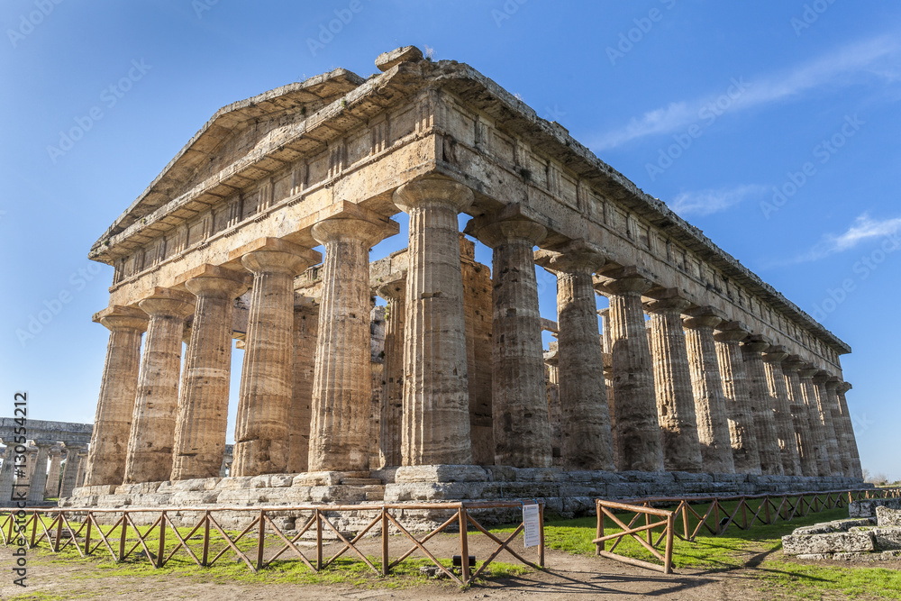 Rear view of greek temple of Neptune, in the archaeological site of Paestum, Salerno, Italy