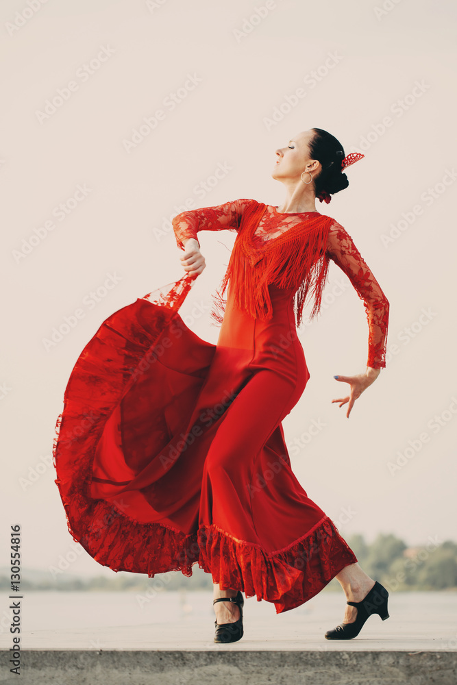Flamenco dancer Spain womans in a long red dress - obrazy, fototapety, plakaty 