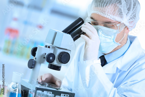 Young male doctor making ex...