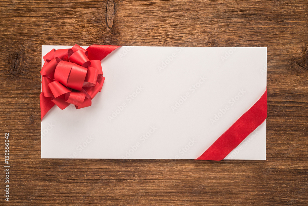 Envelope with decorative red ribbon and bow Envelope with decorative red ribbon and bow