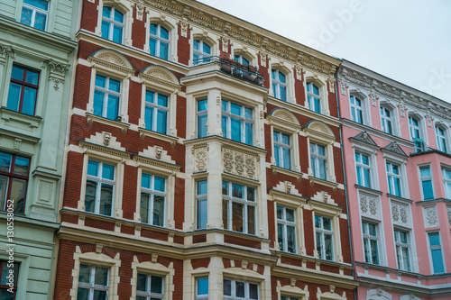 colorful red, pink and white row houses