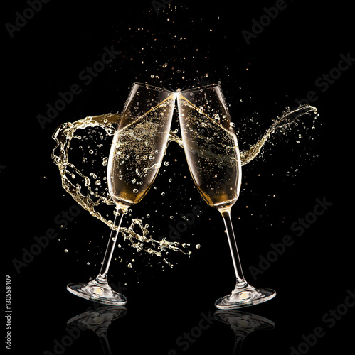Slika na platnu Two glasses of champagne over black background