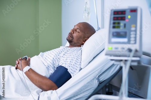 Male patient resting in ward