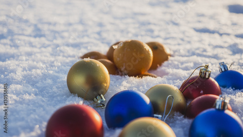 Obraz na plátně tangerines and fur-tree toys on snow