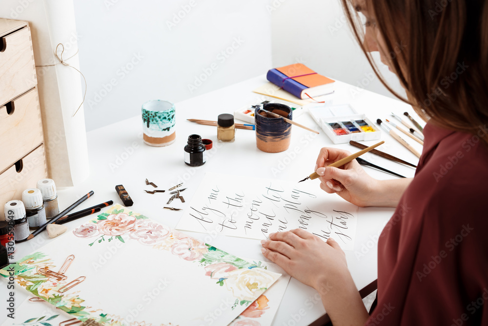 Girl writing calligraphy on postcards. Art design. - obrazy, fototapety, plakaty 