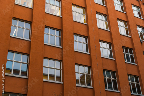 orange office or finance building facade in low angle view