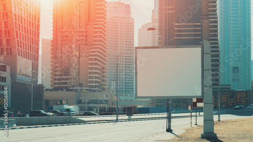 Photography Mock up of blank white advertising billboard in Dubai with residential and offic