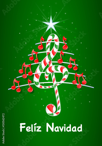 Christmas tree made of red musical notes, candy bar shaped treble clef and pentagram with title: FELIZ NAVIDAD -MERRY CHRISTMAS in spanish language- on green background with stars  - Vector image photo