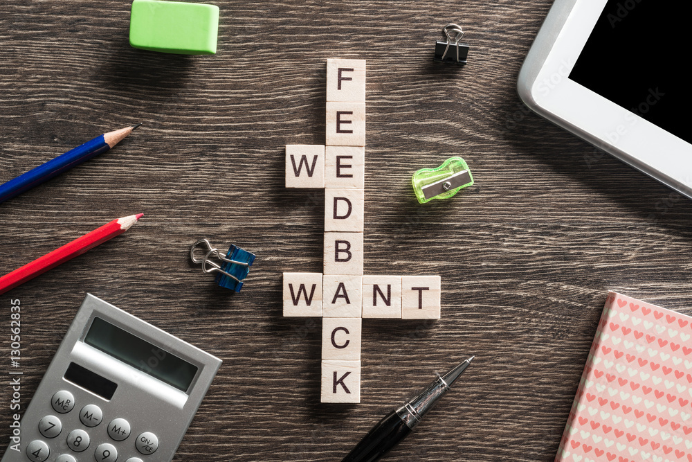 Conceptual media keywords on table with elements of game making crossword Conceptual media keywords on table with elements of game making crossword