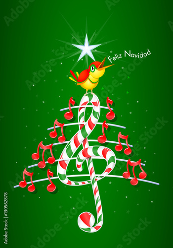 Christmas tree made of red musical notes, candy bar shaped treble clef and pentagram with yellow bird singing and title: FELIZ NAVIDAD -MERRY CHRISTMAS in spanish language- on starry green background photo