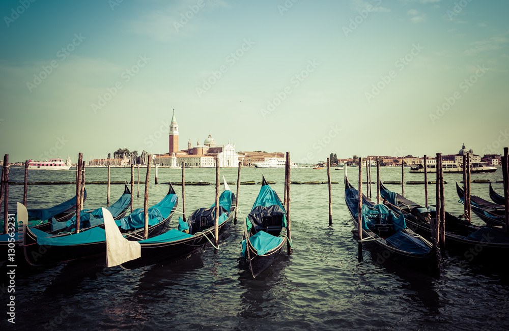 Anchored gondolas on Canal Grande with San Giorgio Maggiore church in the background, Venice, Italy
