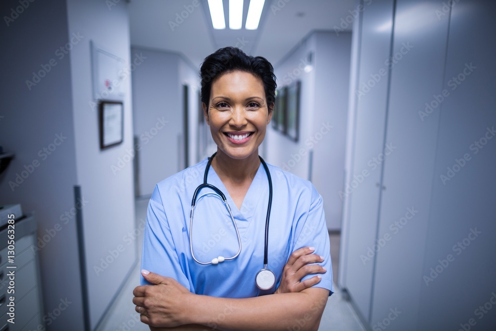 © WavebreakMediaMicro - Portrait of female nurse standing in corridor