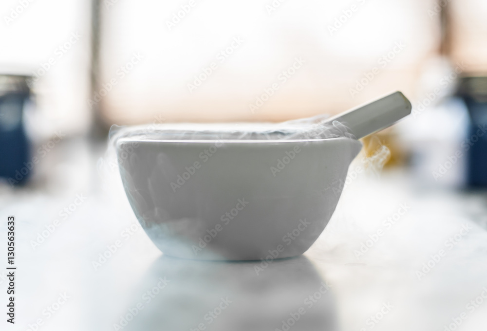 Laboratory experiment with liquid nitrogen in laboratory mortar