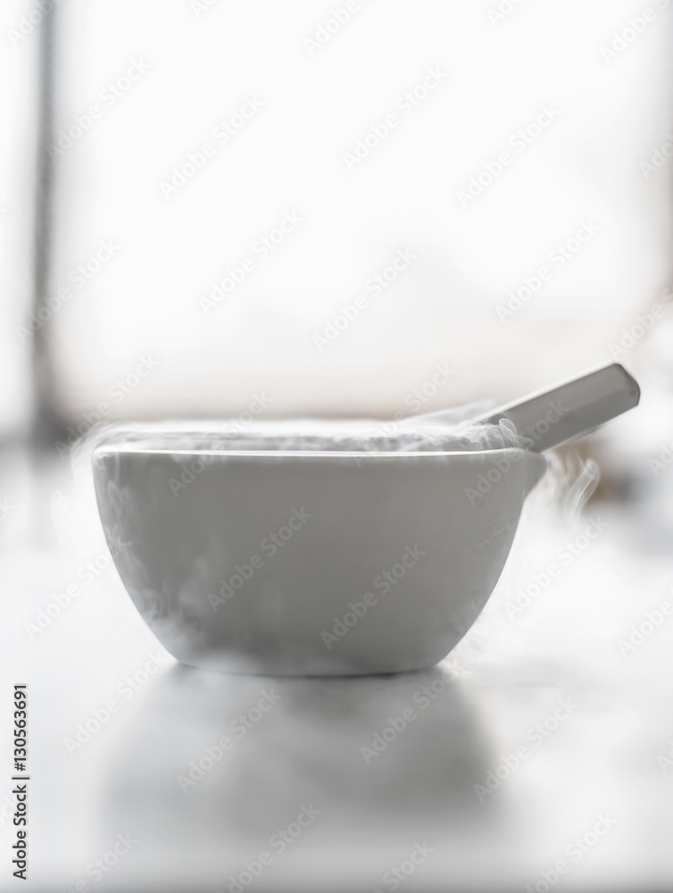 Laboratory experiment with liquid nitrogen in laboratory mortar Laboratory experiment with liquid nitrogen in laboratory mortar