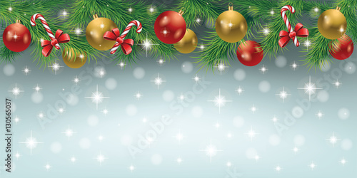 Elegant Christmas background with Christmas toys, candy, tree leaves and snowfall