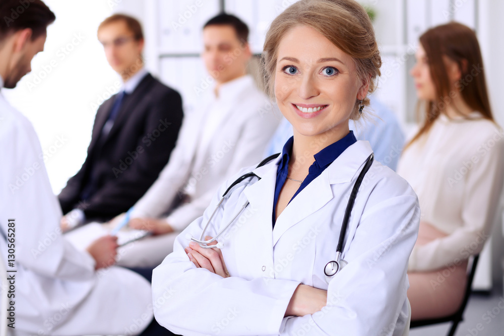 Happy doctor woman with patients Happy doctor woman with patients